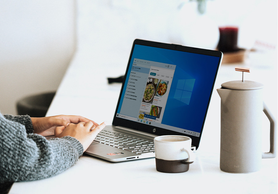 Professional working on a laptop at a desk